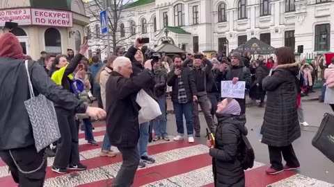 🇺🇦😈 Satanists dance next to a Bandera Mobile (UOC-MP)