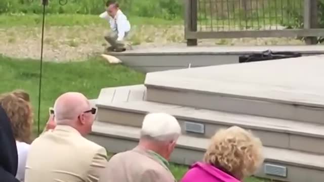 Children provide a sense of humor to a wedding - Ring Bearer Falls!