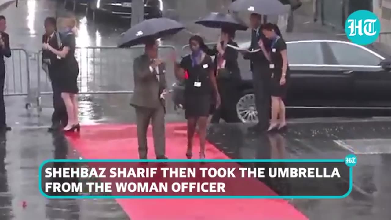 Pak PM 'Pulls' Umbrella From Woman Officer in France; She Is Drenched In Rain | Watch