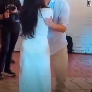 Harry and Meghan enjoy VERY steamy salsa dance before quick kiss