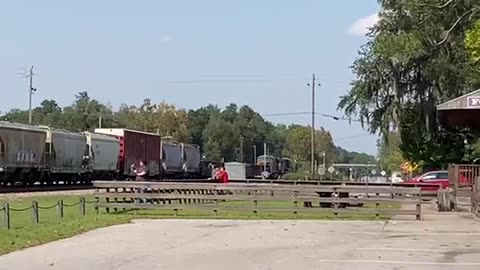 Freshly Painted CSX engine 7385 leads train