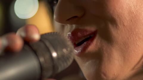 Girl singing into the microphone