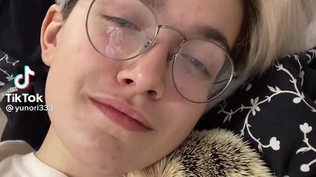chilling with my hedgehog pet