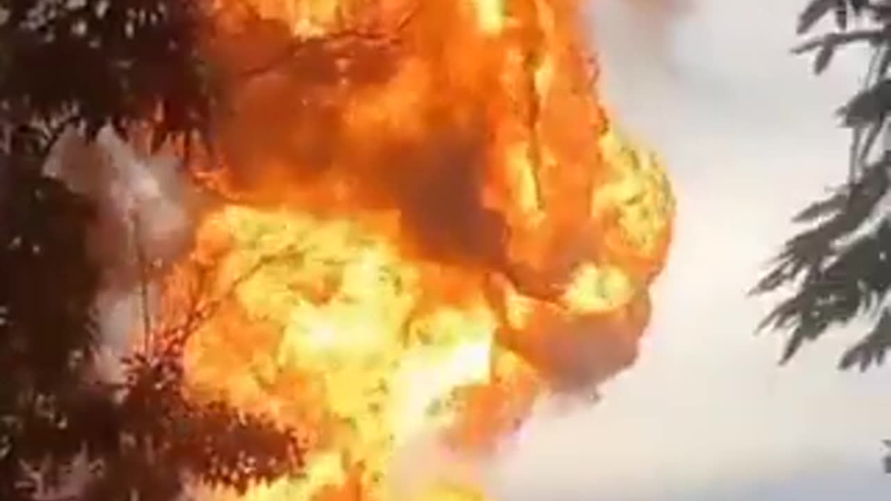 Terrifying scene as 'mud volcano' bursts into a soaring inferno, sending panicked spectators