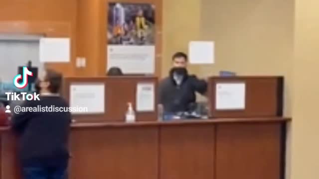 Woman Jumps Over Chase Bank Counter.