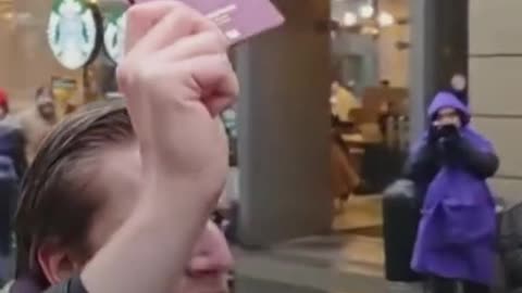 German citizen tears his passport during a demonstration in support of Palestine