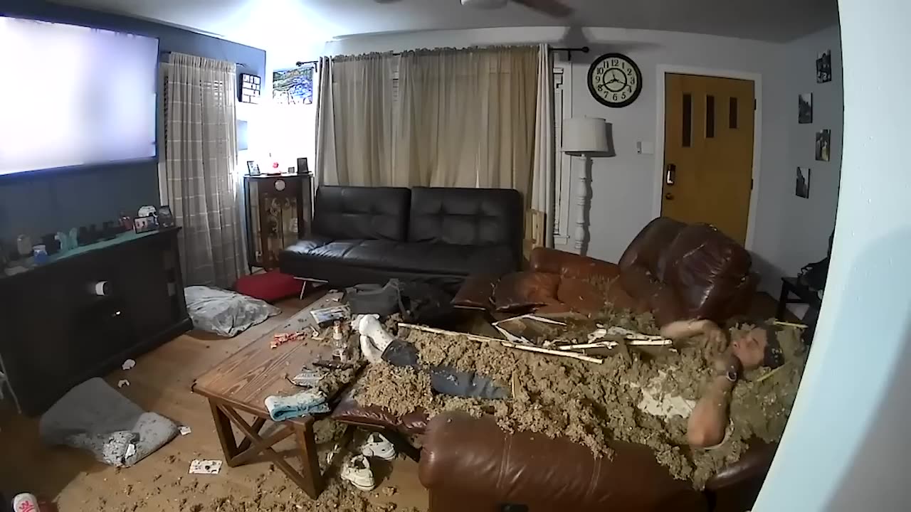 Ceiling Drywall Collapses on Man and Dog Watching TV on the Couch