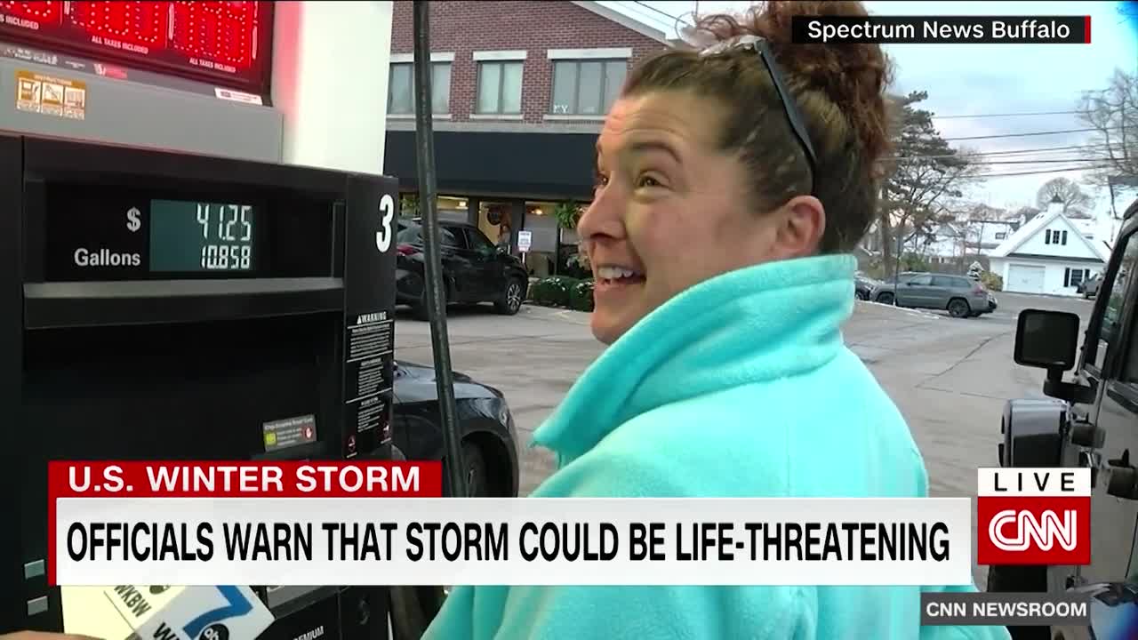 Woman tries to walk in deep snow after massive storm hits New York