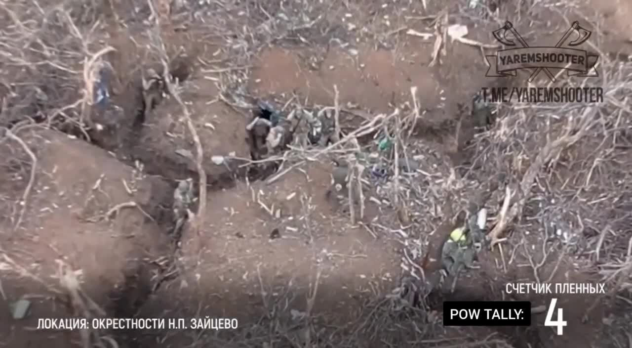 Russians take Ukrainian POW's in the trenches..