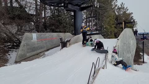 Group Of Friends Fail To Properly Get Off The Ski Lift And One Hits A Man In The Process