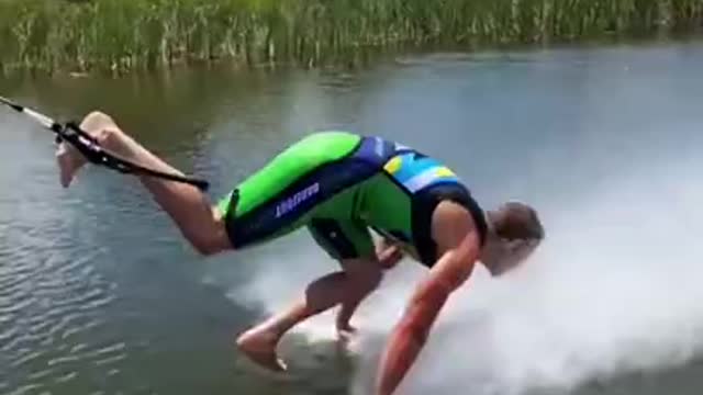 Professional Waterskier Does Push-Ups on Water While Barefoot Skiing