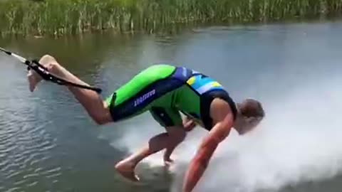 Professional Waterskier Does Push-Ups on Water While Barefoot Skiing