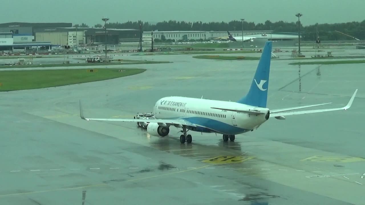 Boeing 737-800 B-5827 performs its pushback before takeoff