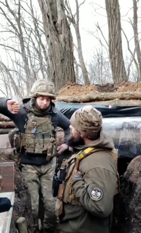 Ukraine troops record moment missile strikes trench