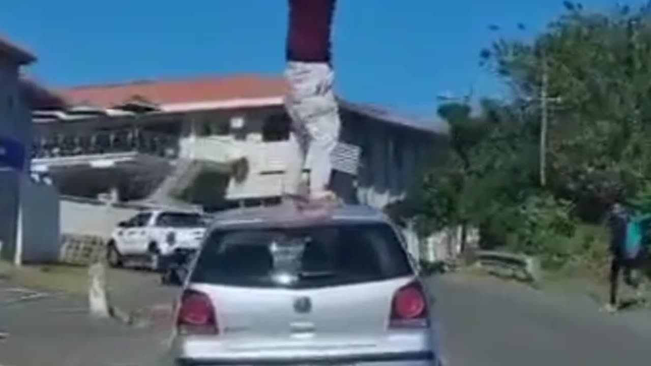 Nothing to see here just a crackhead on top of a car