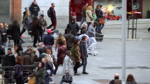 Cristiano Ronaldo surprises a kid on a Madrid's street