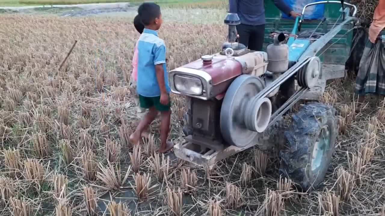 Small boy starting power tiller _ How