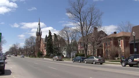 Michigan town with church and traffic