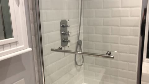 White metro tiling in classic family bathroom