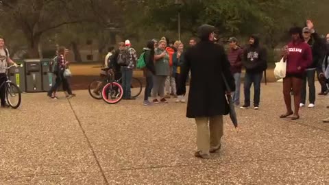 Texas A&M University- Students surround open air preacher