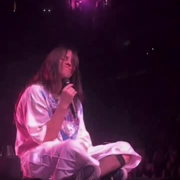 Singer Billie Eilish gets hit in the face after a fan threw an object at her mid performance