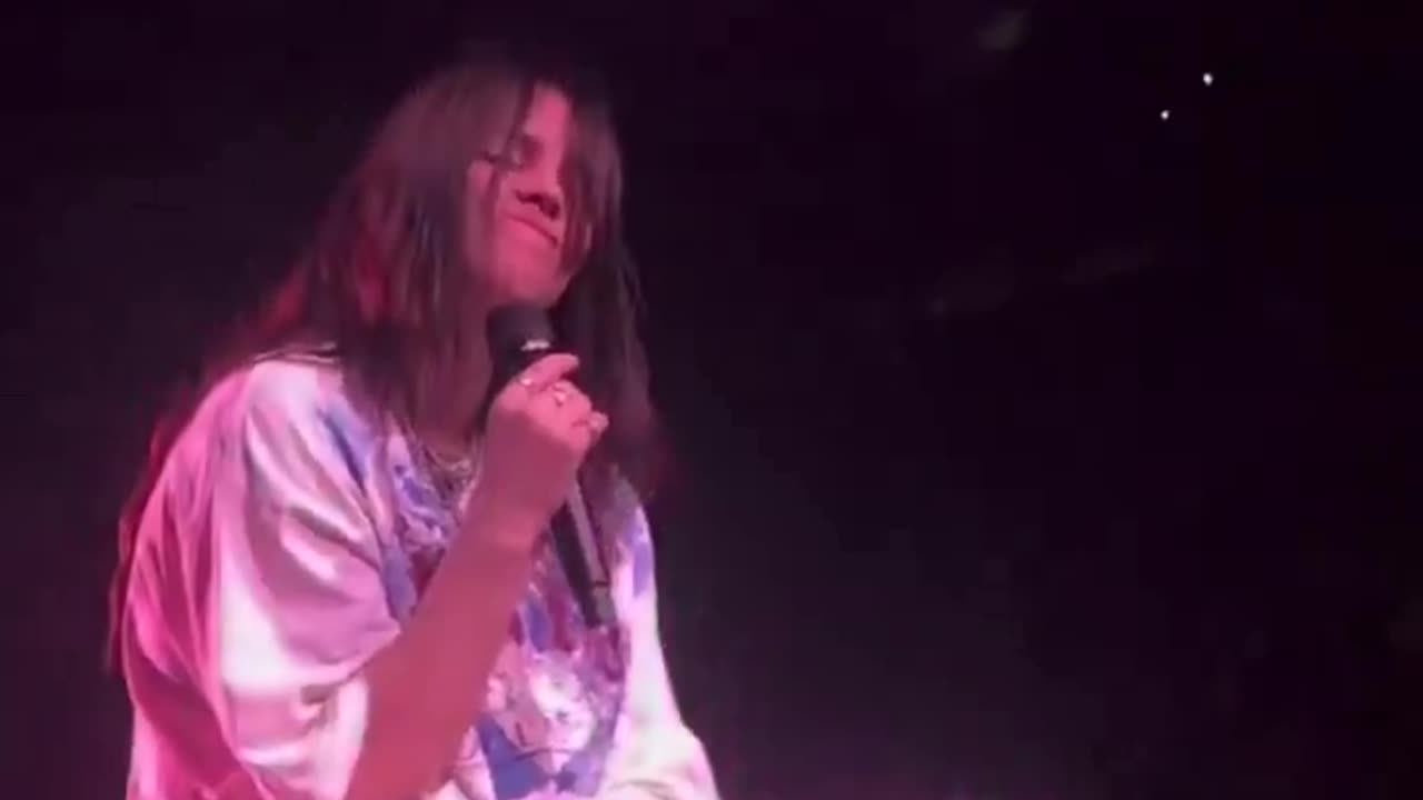 Singer Billie Eilish gets hit in the face after a fan threw an object at her mid performance