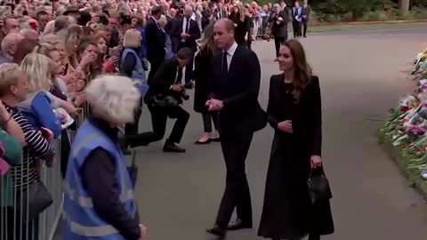 William and Kate view flowers outside Sandringham