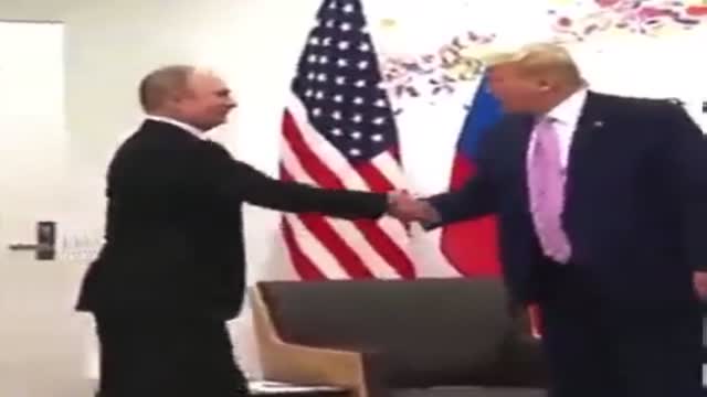 Trump shaking hands with Putin