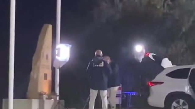 Pretending to be dead behind a live news interview