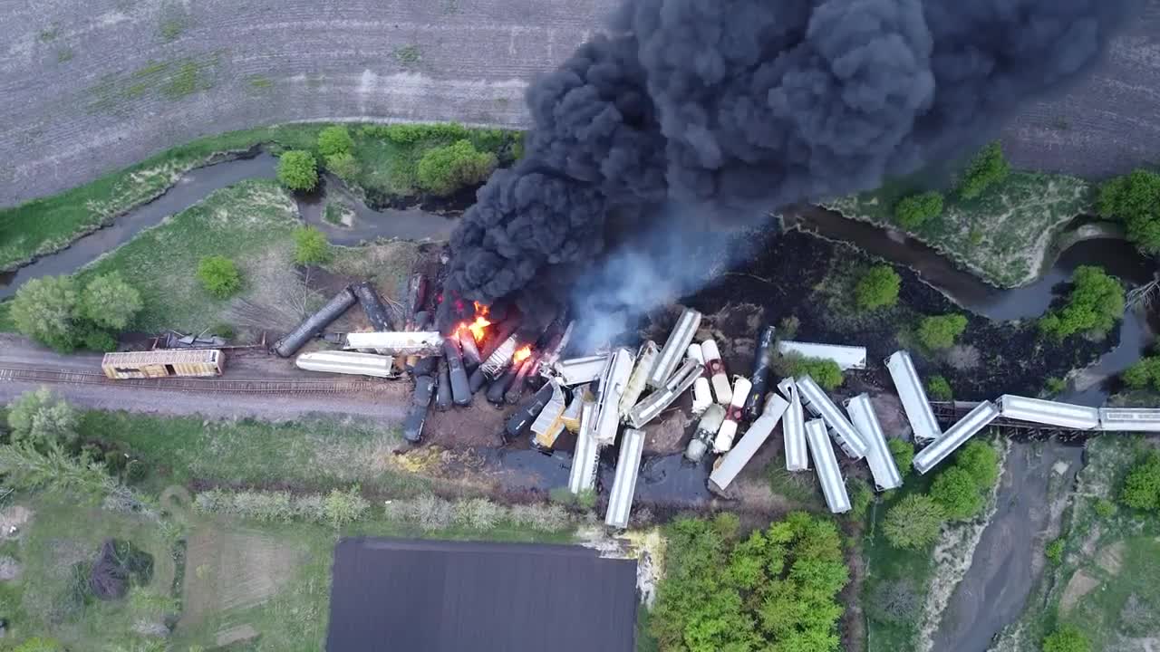 Huge Cloud of Black Smoke Rises From Derailed Train on Railroad