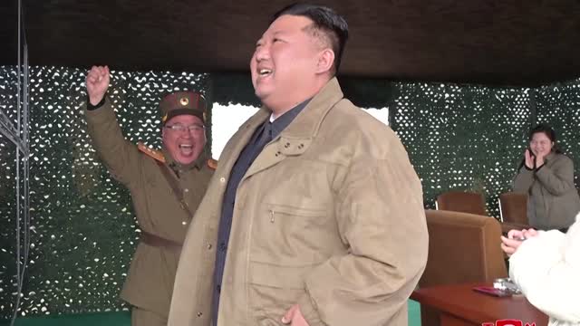 North Korea's Kim reveals daughter at missile test