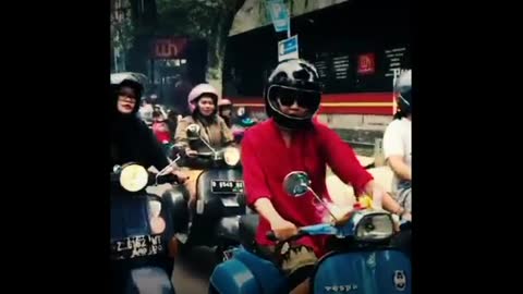 Woman riding vespa