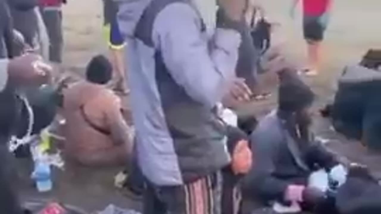 African invaders are handed new phones upon making landing in Europe.