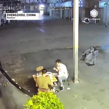 Grabbing a bite in a bit of wind in China