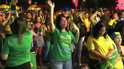 Bolsonaro voters pray as rival