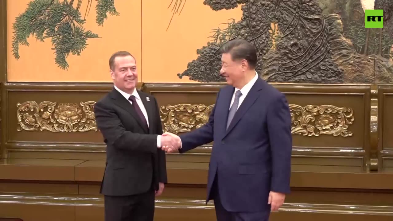 Chinese President Xi Jinping holds talks with Russia's Dmitry Medvedev in Beijing.