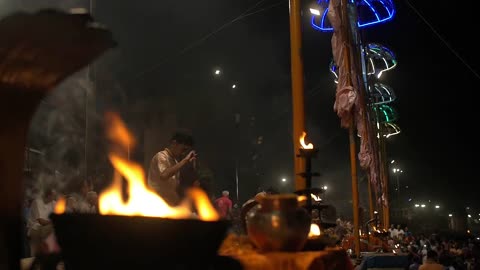 Men Performing Ganga Aarti Ceremony in India