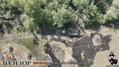 Ukrainian soldiers used a combat drone to throw a mine into the open hatch of a Russian tank