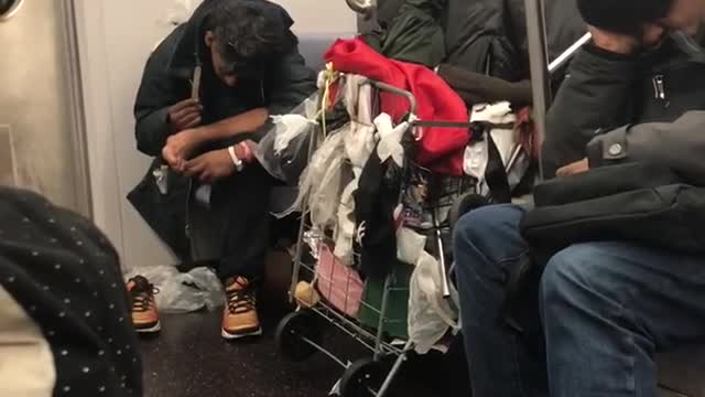 Guy gives himself a pedicure and files toenails on subway train