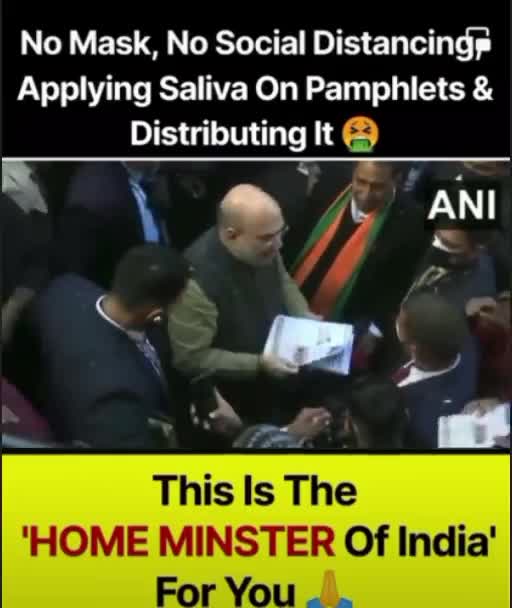 Amit Shah distributing the form by spitting