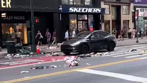 African migrant scatters garbage around in New York.