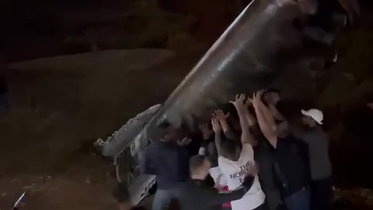 palestinians praise their demon god after raising destroyed iranian missile