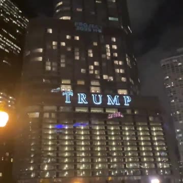 “Project 2025 HQ” is projected on Trump Tower in Downtown Chicago
