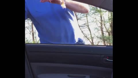 Man Struggles To Crawl Through Car Window