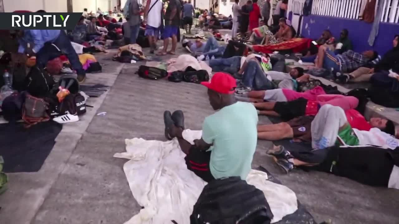 Members of a migrant caravan en route to the US border sleep on Huixtla’s streets