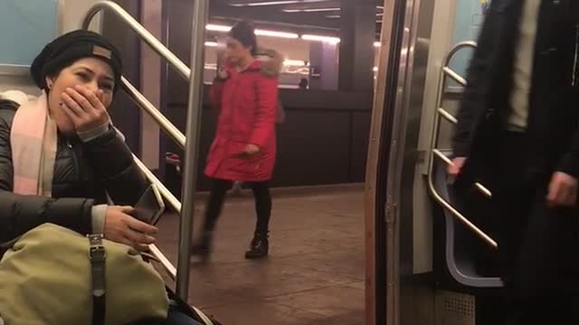 Shirtless man exercises and runs in place at a subway station