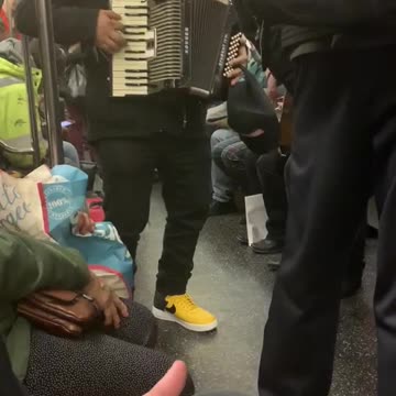 Mexican band plays music in subway train
