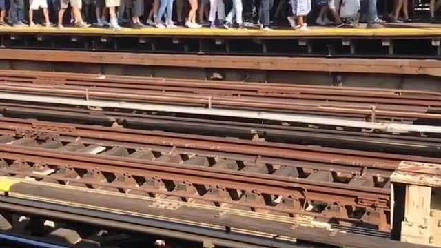 Long line of people at station next to yankee stadium