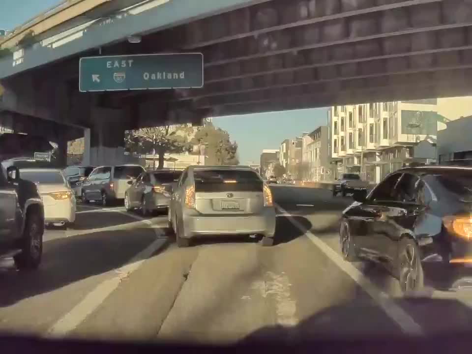 Caught in San Francisco on dash cam. Daylight freeway robbery.