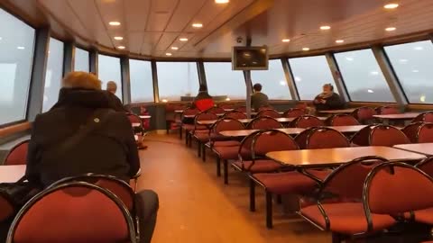 Water crashes through the front windows of a ferry